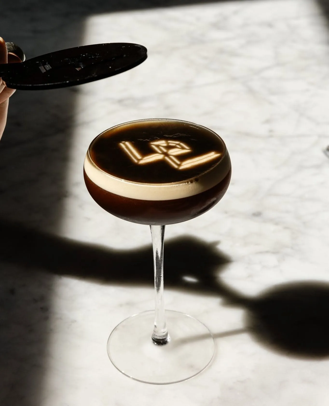 An espresso martini on the marble bar at Wright & Company